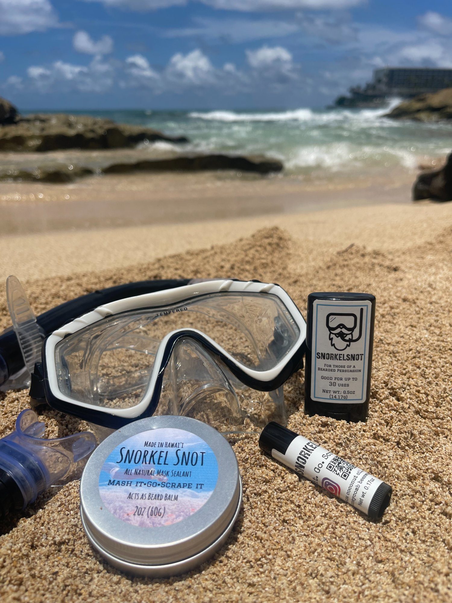 SnorkelSnot products on the beach with dive mask